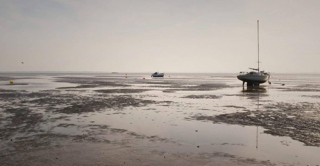 Boats at low tide on the Thames Estuary